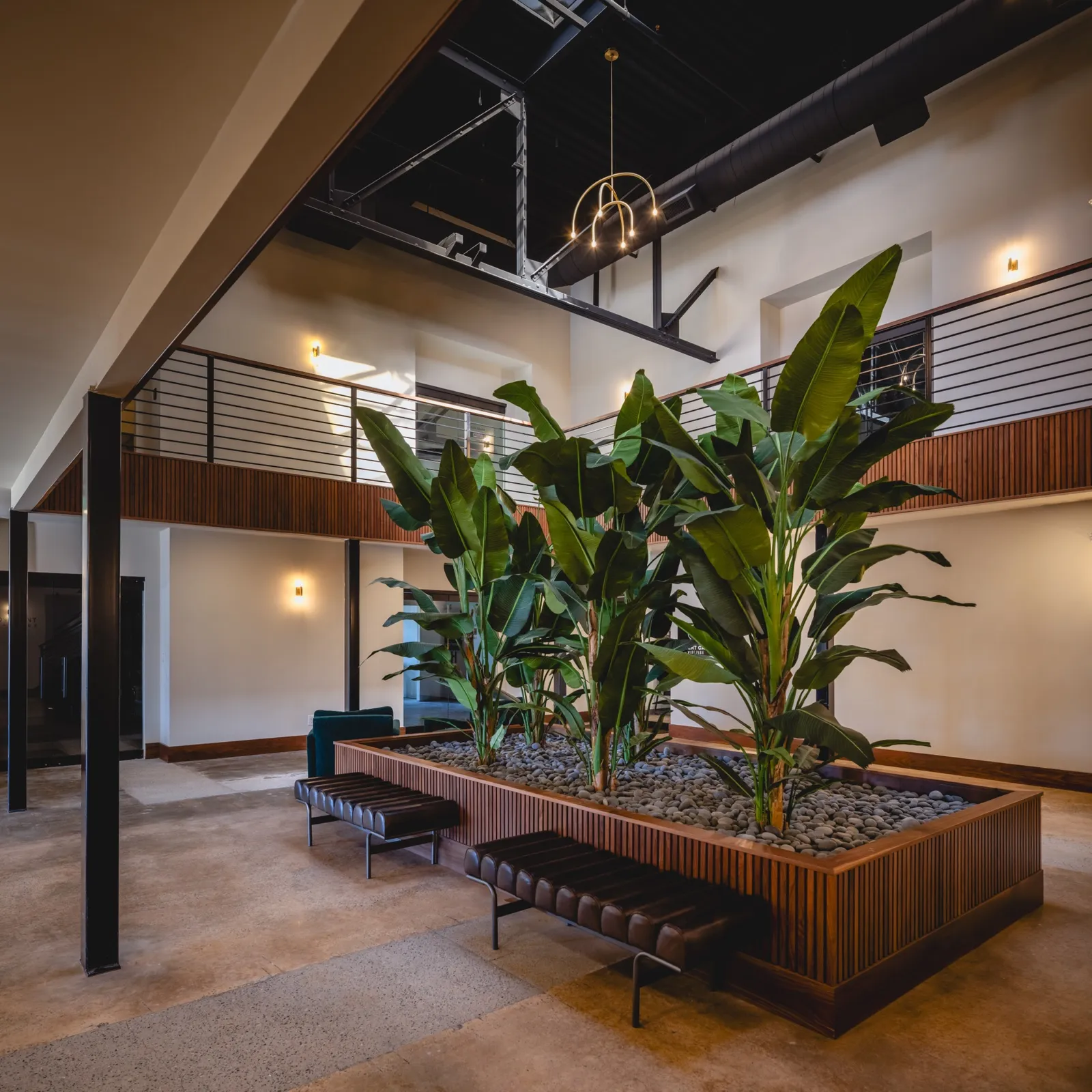 Two-story lobby atrium with planter and seating