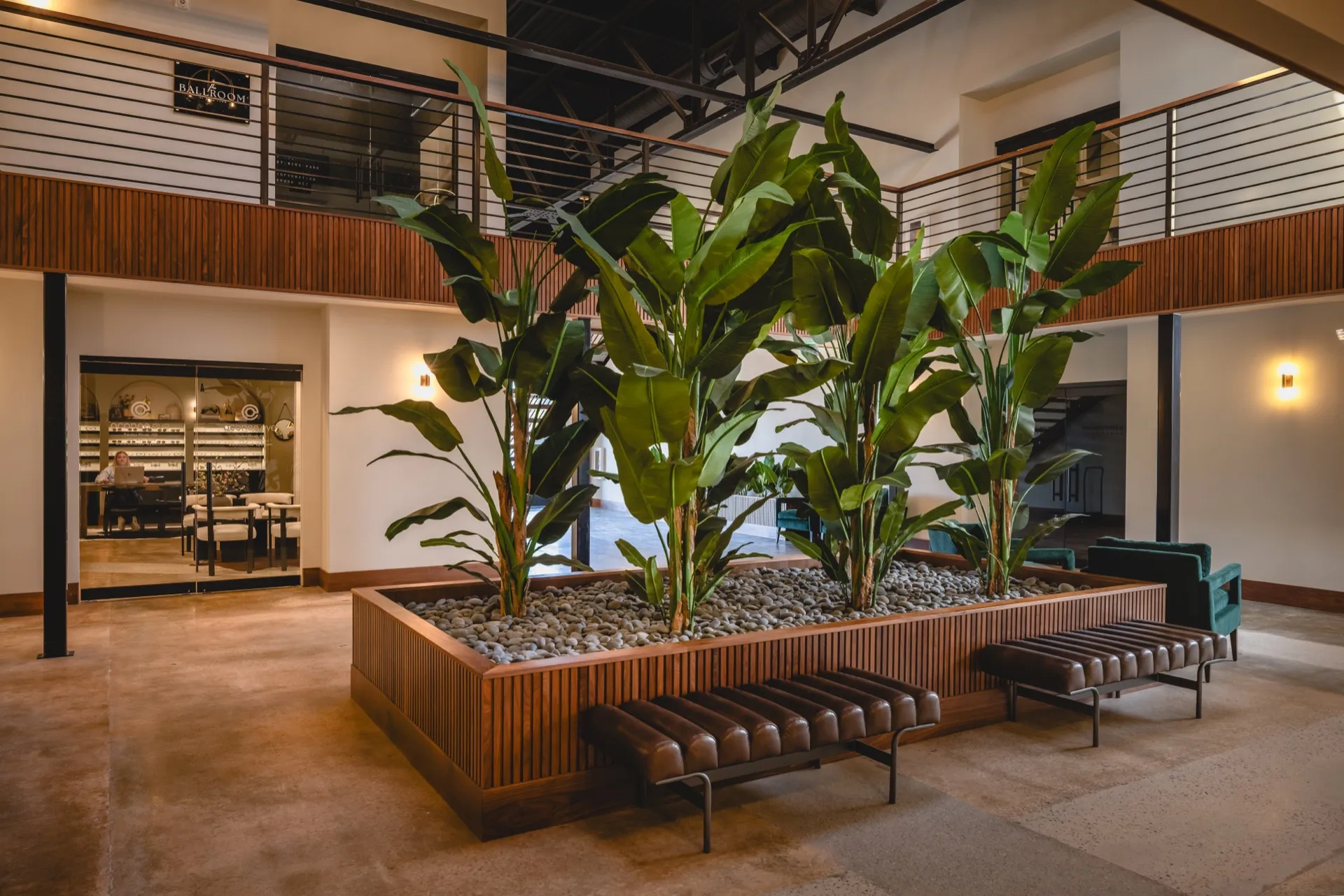 Lobby atrium with mezzanine and tenant storefronts
