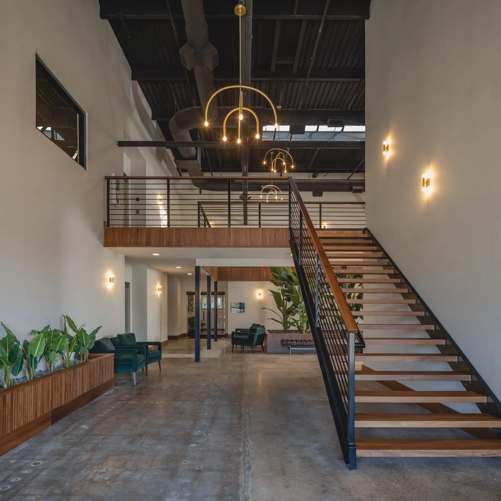 Shared lobby with open staircase and lounge seating